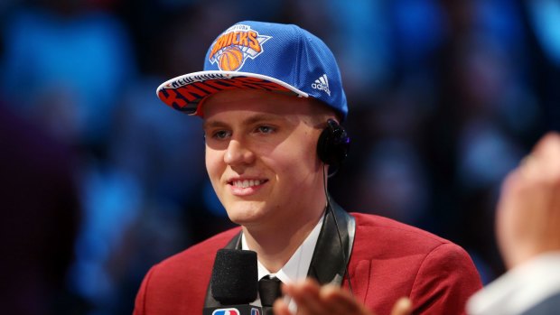 Baby-faced assassin: Kristaps Porzingis speaks to the media after being selected fourth overall by the New York Knicks.