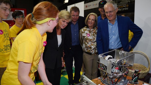 Australian Prime Minister Malcolm Turnbull (right) along with Foreign Minister Julie Bishop (second from left) and Assistant Minister Craig Laundy (middle) and wife Lucy Turnbull meet with competitors as they tour the FIRST Global Robotics Competition in Sydney.
