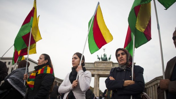 Supporters of the Kurdish cause demonstrate at the Brandenburg Gate in Berlin 
