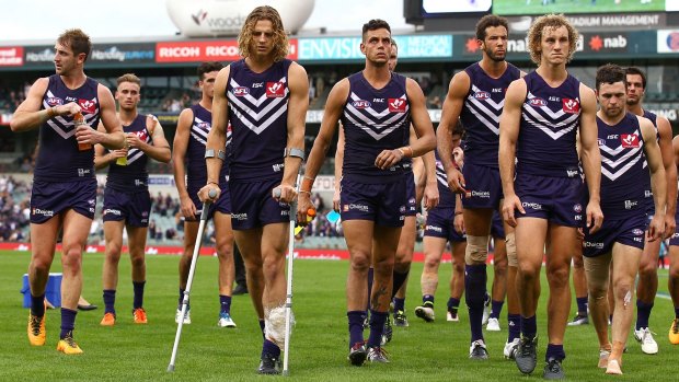 Nathan Fyfe leads the Dockers off Domain Stadium, their season in disarray.