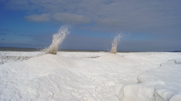 Ice volcanoes occur in locations in which waves hit accumulated ice on the shoreline with some force.