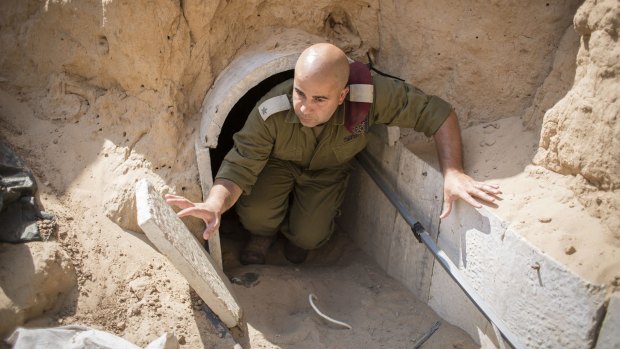 An Israeli soldier emerges from a tunnel built by Hamas militants leading from the Gaza Strip into southern Israel in August 2014.