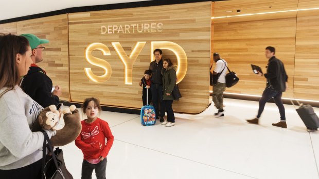 Fancy new departure gates at Sydney Airport opened late last year, but we won't be walking through them any time soon.