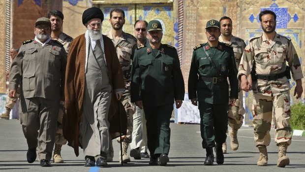 Iran's Ayatollah Ali Khamenei, third from left, with officers from the Iranian military.