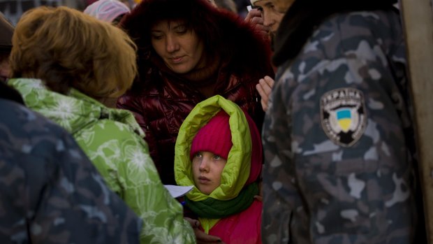 Internally displaced Ukrainians from Donetsk wait to receive donated food in Kiev at the weekend.