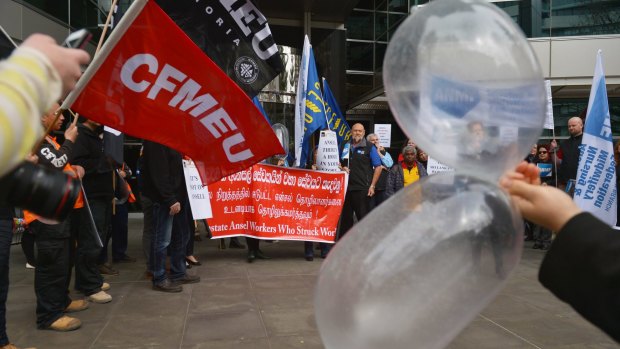 Textile and manufacturing workers protest outside Ansell's head office.