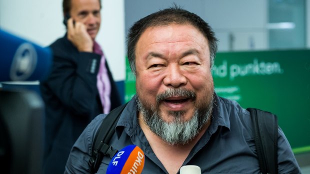 Ai Weiwei talks to the media in Munich on Thursday. 