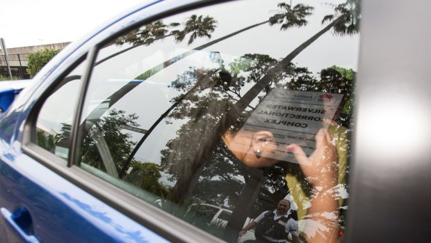 Alo-Bridget Namoa is rushed in a car from Silverwater jail earlier this month.