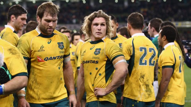 'It's news that you never want to wake up to' ... Wallabies captain Michael Hooper, centre, on the loss of Phillip Hughes.