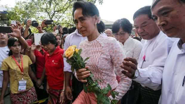 Aung San Suu Kyi, Myanmar's opposition leader and chairperson of the National League for Democracy (NLD), arrives at the party headquarters in Yangon on Monday.