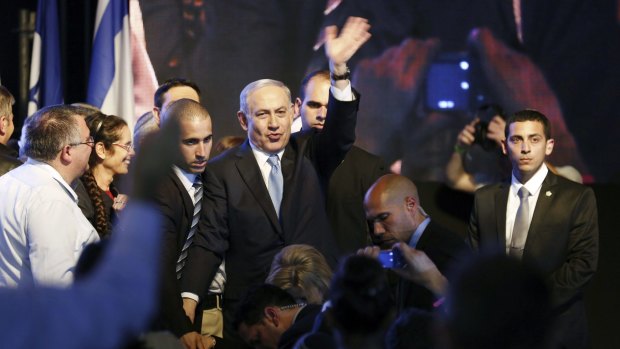 Benjamin Netanyahu arrives in triumph at Likud Party headquarters.