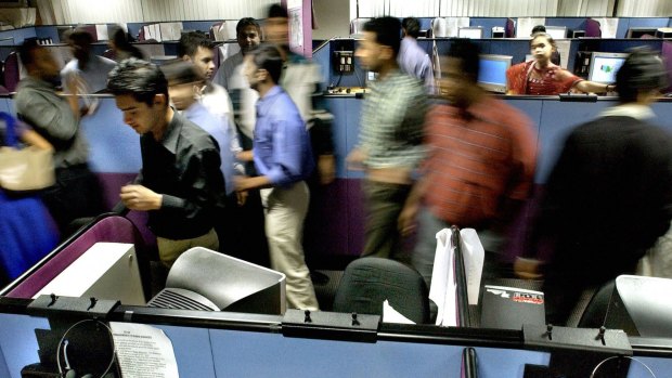Indian employees at a 24-hour call centre in Bangalore. India's technology-related sectors are growing rapidly but unemployment grows faster.