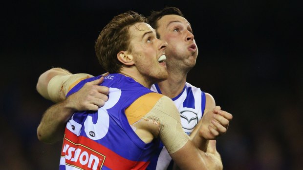 The Bulldogs' Jordan Roughead and Kangaroo Todd Goldstein compete for the ball during their round 20 AFL clash. 