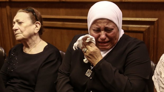 Friends and relatives of EgyptAir hostess Yara Hani who was working aboard EgyptAir MS840 mourn during a ceremony at a church in Cairo on Satruday.