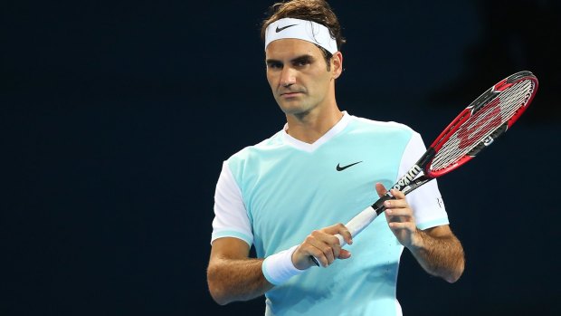 Federer in action against Milos Raonic on Sunday night.