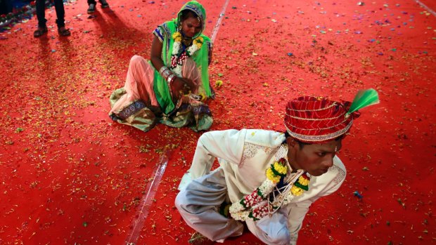 An underprivileged couple arrive to take part in a mass wedding in Mumbai, India earlier this year.