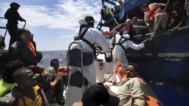 Refugees on a wooden boat carrying 565 people are rescued off the Libyan coast by Migrant Offshore Aid Station crew.