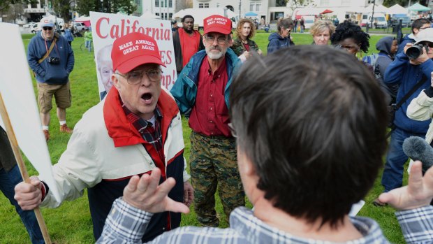 Trump supporter Jim Templeton, left, yells at an anti-Trump protester at a dual rally for and against President Donald Trump on  March 4.