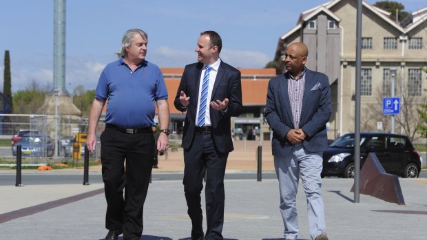 Signed up: Chief Minister Andrew Barr talks with future Uber drivers Gary Woodbridge and Teferi Gungl. 