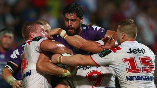 Jesse Bromwich, seen here being tackled in the game against the Dragons, says the Storm is ready for the Sharks.