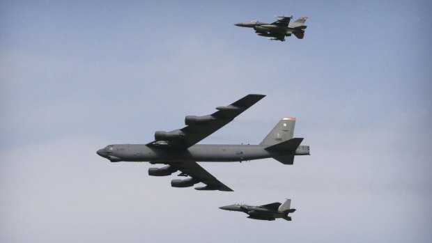 A US Air Force B-52 bomber flies over Osan Air Base in Pyeongtaek, South Korea, on  January 10, in a show of force after North Korea's bomb test. 