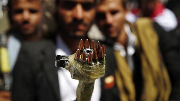 A Shiite fighter, known as a Houthi, with a modified weapon at a demonstration in Sanaa, Yemen on Sunday. 
