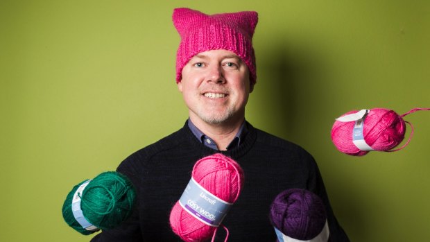 Stephen Lawton is leading a group of volunteers in knitting "pussyhats" to help raise money for frontline domestic violence services. 