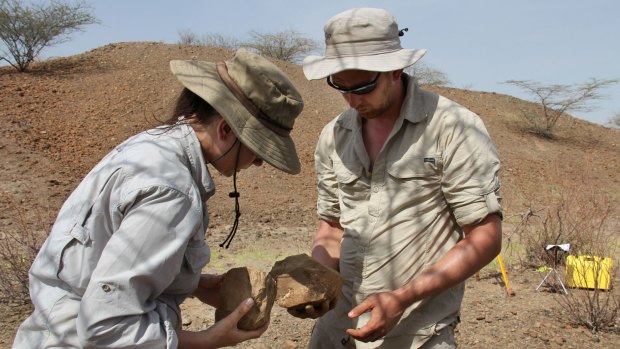 Sonia Harmand and Jason Lewis with stone tools found in the West Turkana area of Kenya. 