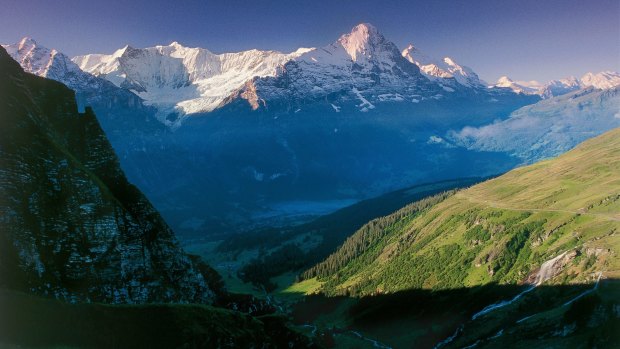 View above Grindelwald towards the Fiescherhoerner and the Eiger in the Bernese Oberland.