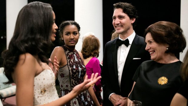 Malia and Sasha Obama talk with Canadian Prime Minister Justin Trudeau and his mother, Margaret.