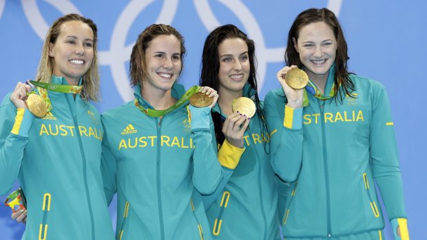 Australia's 4x100m freestyle relay team show off the gold medals they won on the first night in Rio.