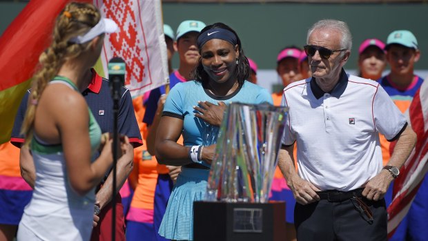 Serena slam: Indian Wells tournament director Raymond Moore, right, with Serena Williams, centre.