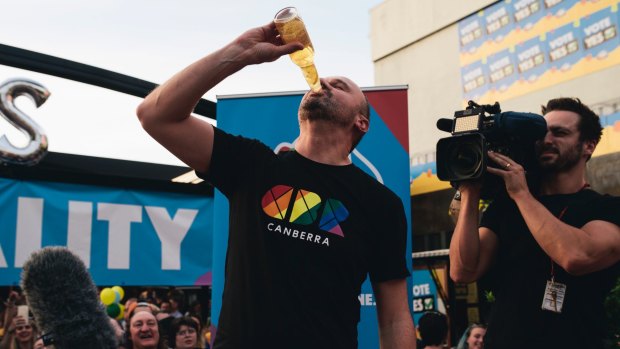 More elegant than Bob Hawke and his schooners. ACT Chief Minister Andrew Barr celebrated Australian voting yes for marriage equality by downing a Corona. And, yes, there was a slice of lemon in there.