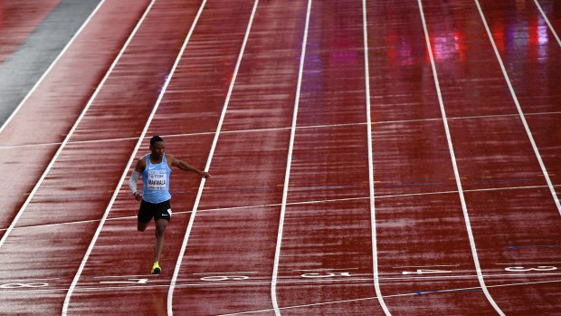 One is the loneliest number: Botswana's Isaac Makwala crosses the finish line in his heat.