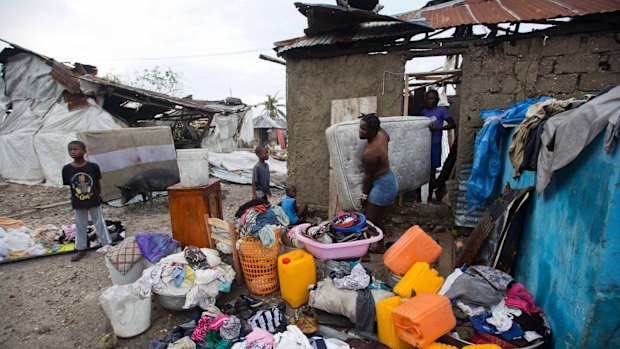 Personal items are set out to dry as homeowners cull through the debris of their homes destroyed by Hurricane Matthew in Les Cayes, Haiti.