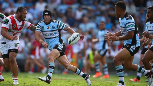 Sending it wide: Michael Ennis passes during the round two NRL match between the Cronulla Sharks and the St George Illawarra Dragons at Southern Cross Stadium.