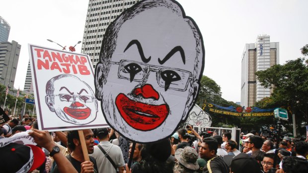 Student activists holds up a caricature of Malaysian Prime Minister Najib Razak in Kuala Lumpur in August.