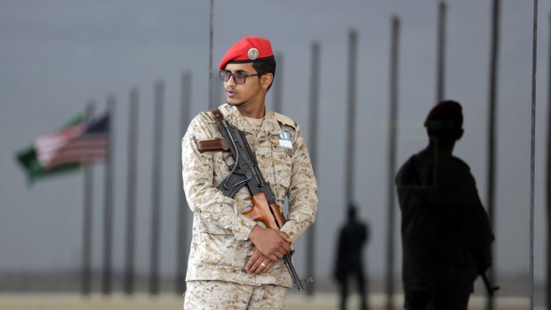 Saudi soldiers stand guard during US President Barack Obama's arrival in Riyadh.