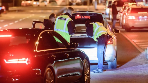 Police check arriving cars outside Schoenefeld Aiport near Berlin following the launch of a manhunt for  terror suspect Jaber Albakr. 