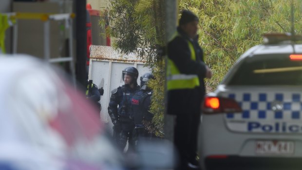 Police in riot gear outside the Parkville Youth Justice Centre. 