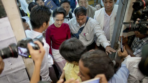 Aung San Suu Kyi leaves after casting her vote at a polling station in Yangon.