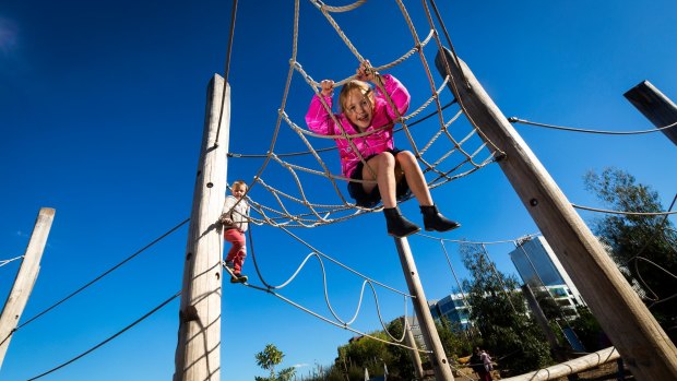 Anna, 6, hangs around at the playground. 
