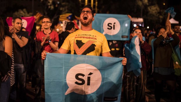 Catalan independence supporters gather in Barcelona's main square on Sunday.