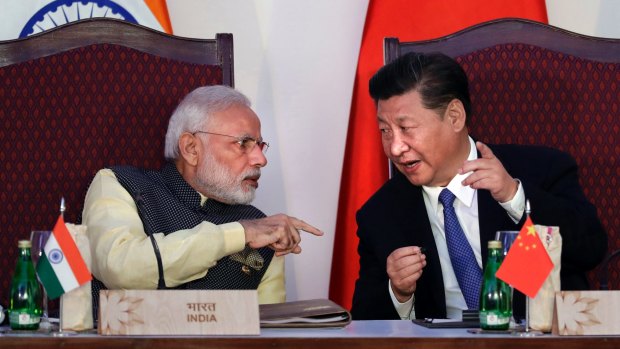  Indian Prime Minister Narendra Modi, left, talks with Chinese President Xi Jinping at the BRICS summit in Goa, India, last year.