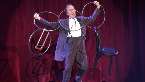 The Eccentric, aka Charlie Frye, performs with the linking rings.