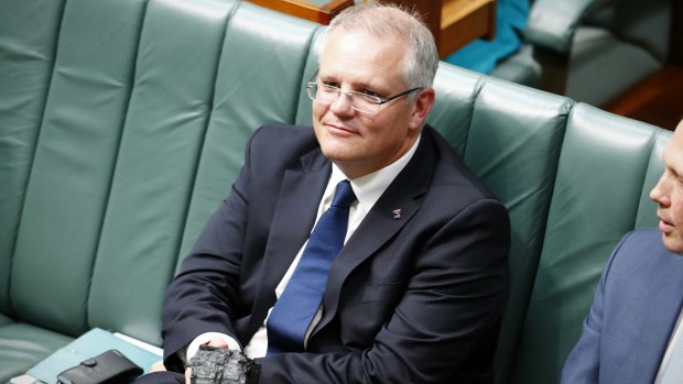 Treasurer Scott Morrison with a lump of coal during question time.