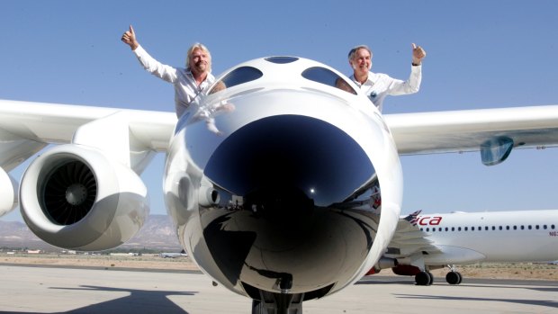 Richard Branson, left, in his concept craft, SpaceShipTwo. 
