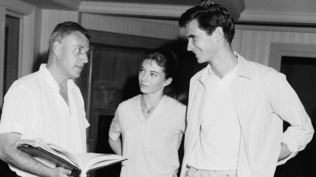Stanley Kramer (left), Donna Anderson and Anthony Perkins on set.