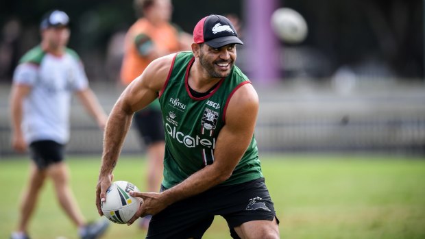 All smiles: Greg Inglis is 'like a little kid out there' at South Sydney training.