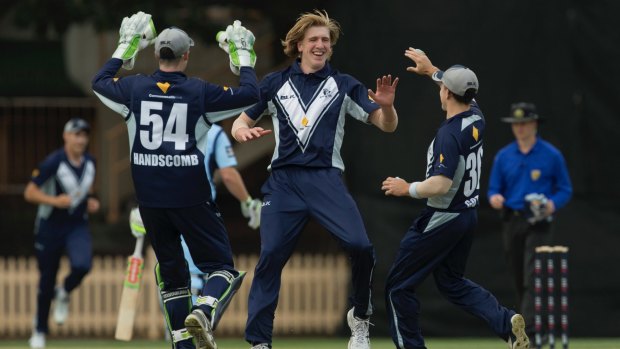 Will Sutherland celebrates a wicket for Victoria on Sunday.